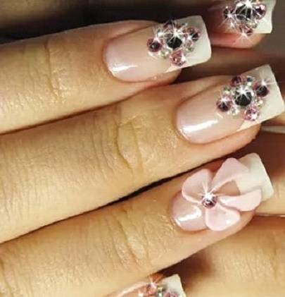 Pink nail design with rhinestone